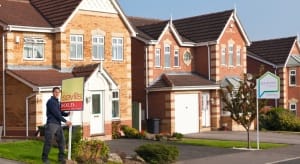 Estate agency boards outside houses - Property activity
