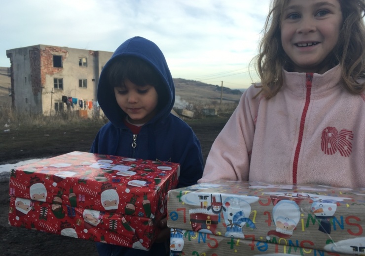 Agency Express Christmas shoebox appeal - Young gir and boy with gift