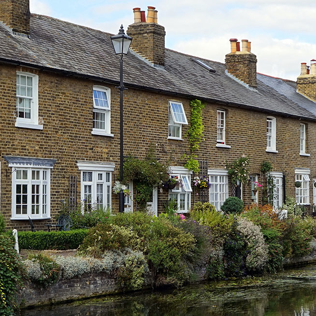 Row of cottages next to a river - Property Activity Reports